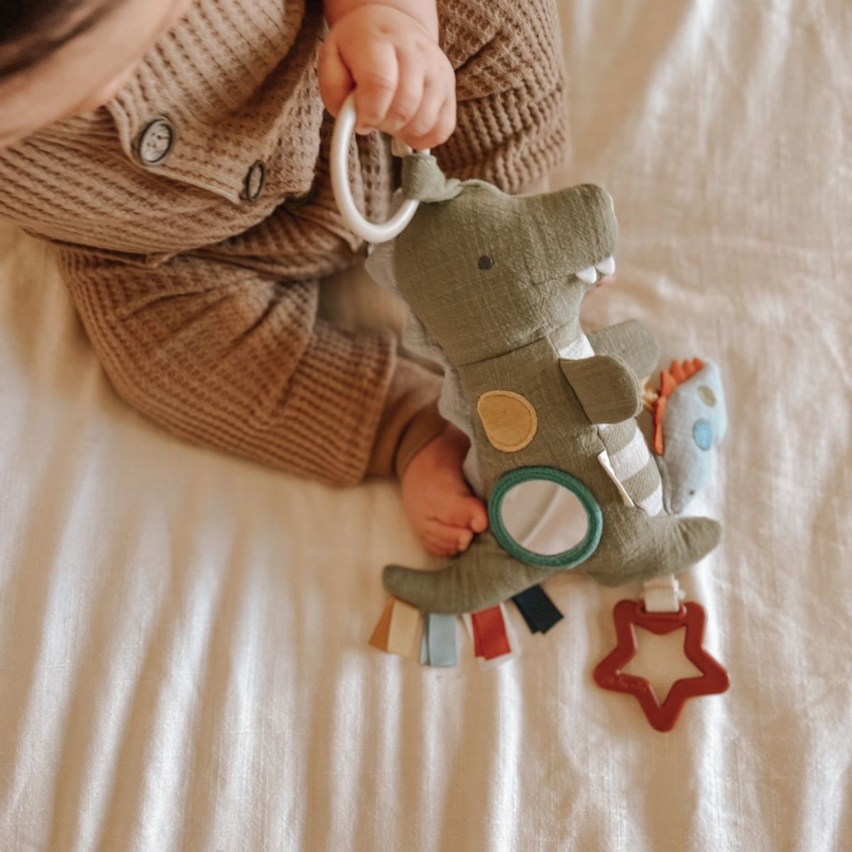 Itzy Ritzy Bitzy Traveler Developmental Sensory Toy - Dino - Supports Early Development