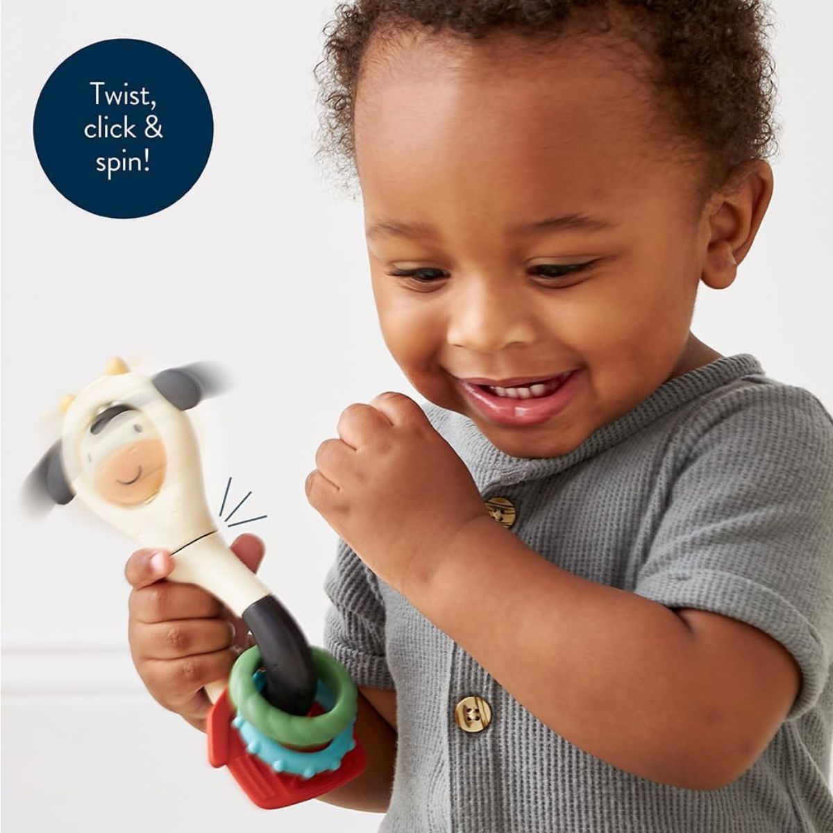 Itzy Ritzy Spinner Rattle - Carmen the Cow - Multi Sensory Play Experience